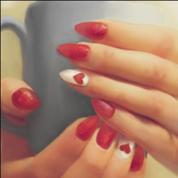 Drawn image of hands with manicured nails holding a mug